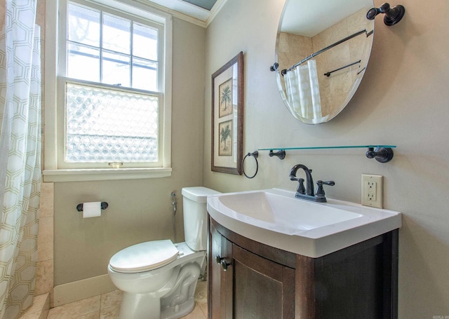 bathroom with a shower with shower curtain, toilet, vanity, tile patterned flooring, and baseboards