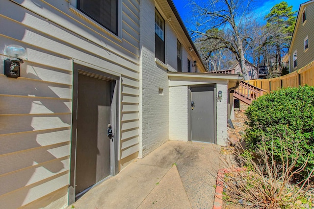 property entrance with fence