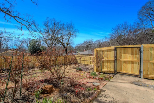 view of yard with a gate and fence