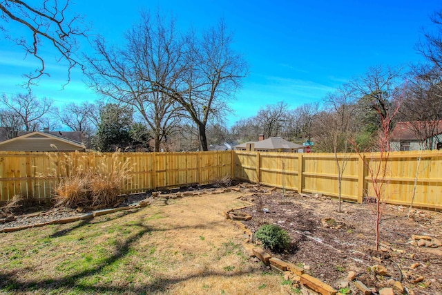 view of yard featuring a fenced backyard