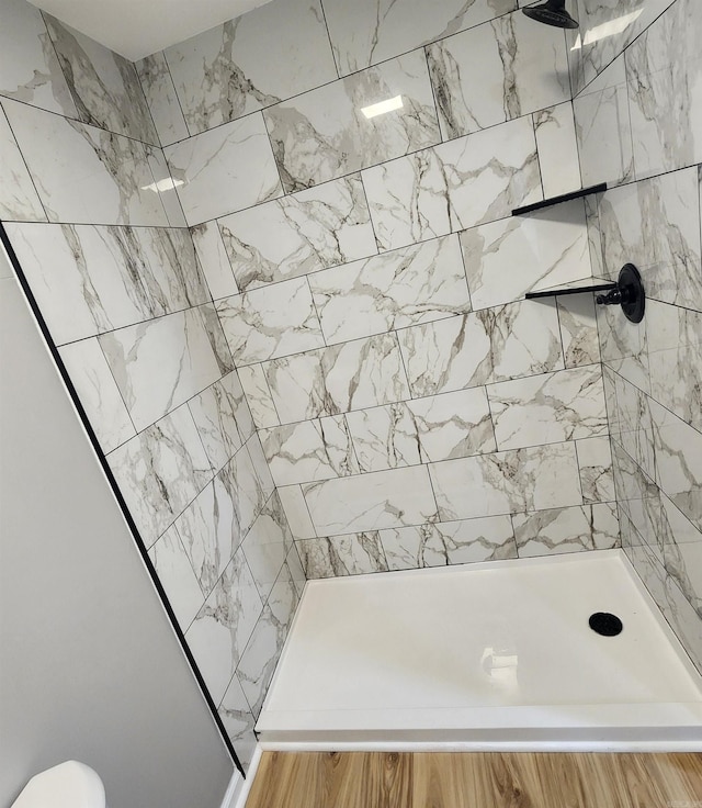 bathroom with a tile shower