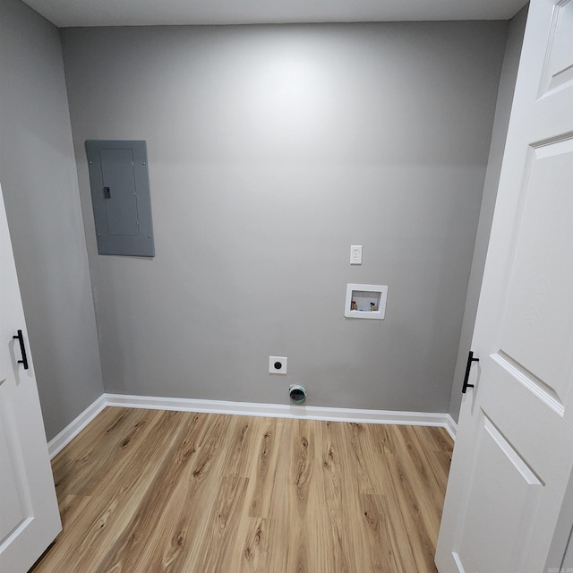 laundry area with hookup for a washing machine, hookup for an electric dryer, laundry area, light wood-type flooring, and electric panel