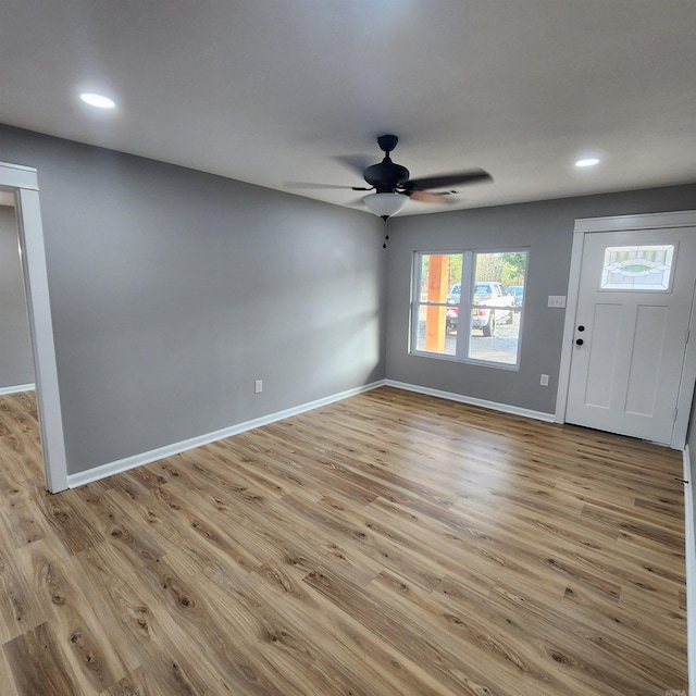 foyer featuring a ceiling fan, recessed lighting, baseboards, and light wood finished floors