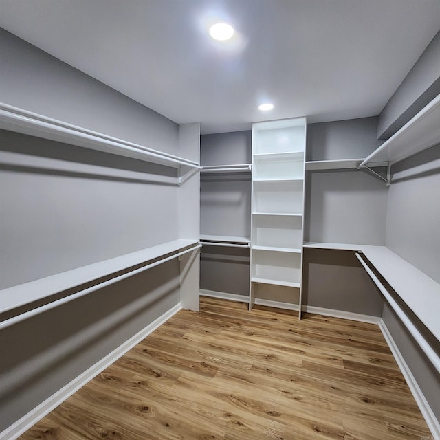 spacious closet with wood finished floors