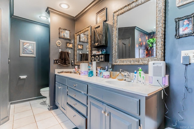 full bath featuring double vanity, toilet, ornamental molding, tile patterned flooring, and a sink