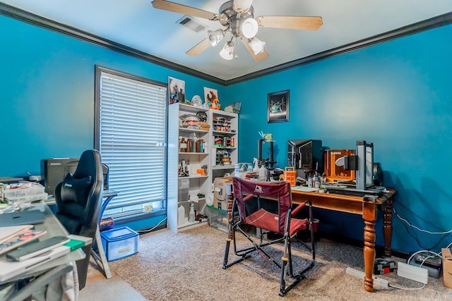 carpeted office with visible vents, a ceiling fan, and crown molding