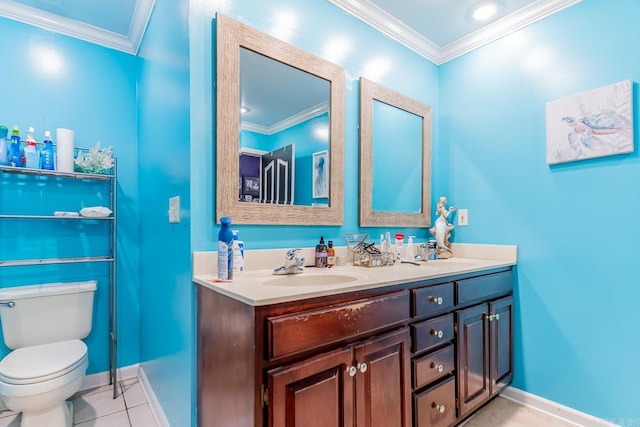 full bath with double vanity, ornamental molding, a sink, and toilet