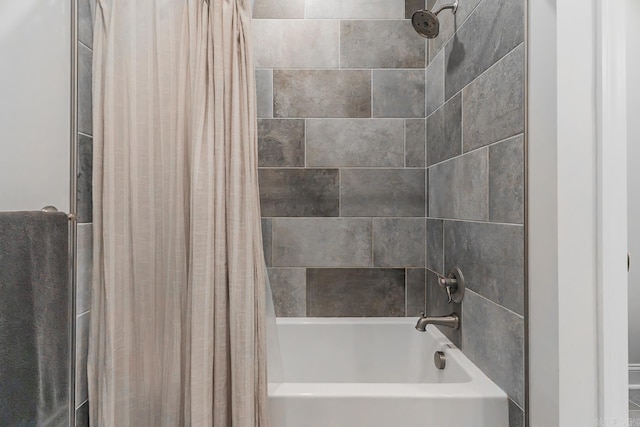 bathroom featuring shower / tub combo with curtain