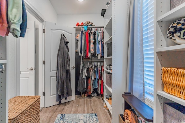 spacious closet with wood finished floors