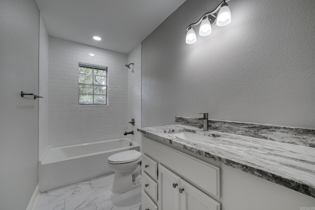 bathroom with toilet, marble finish floor, bathing tub / shower combination, and vanity