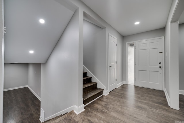 foyer entrance featuring stairway, recessed lighting, wood finished floors, and baseboards