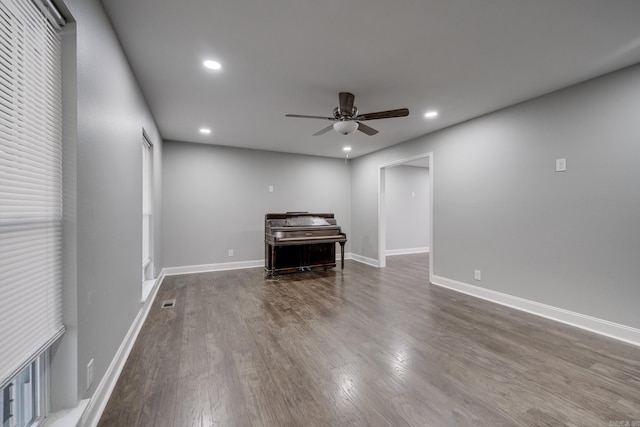 interior space featuring recessed lighting, baseboards, and wood finished floors