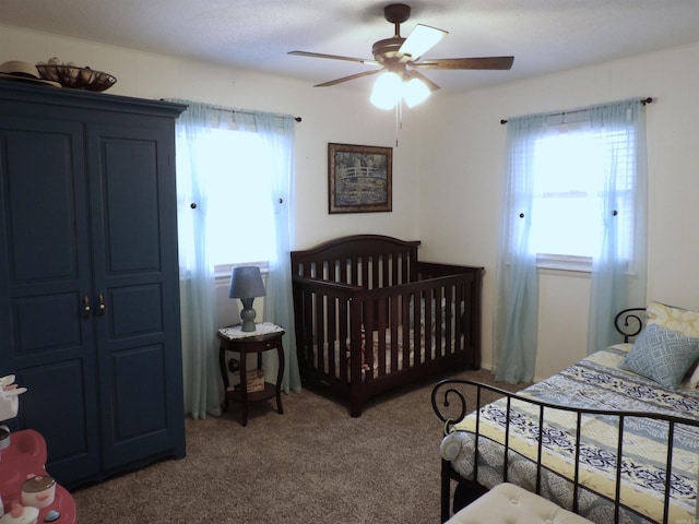 carpeted bedroom featuring ceiling fan