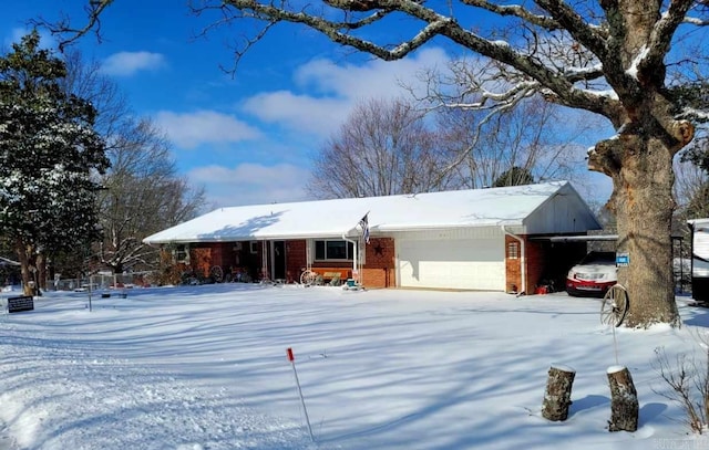 ranch-style house featuring a garage and brick siding