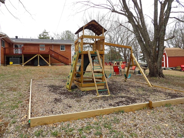 view of play area featuring a shed and an outdoor structure