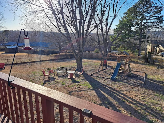 view of yard with a playground and fence