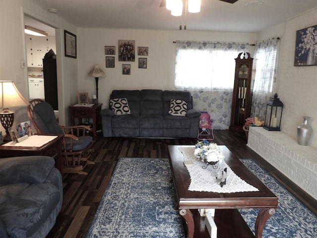 living room with ceiling fan and wood finished floors