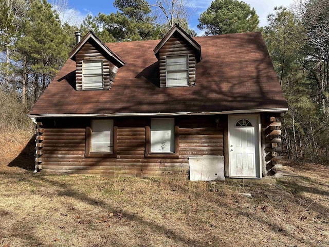 view of front facade featuring log siding