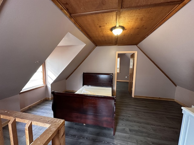 unfurnished bedroom featuring baseboards, lofted ceiling, wood finished floors, and wooden ceiling