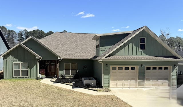 view of front of home with board and batten siding, concrete driveway, a shingled roof, and a garage