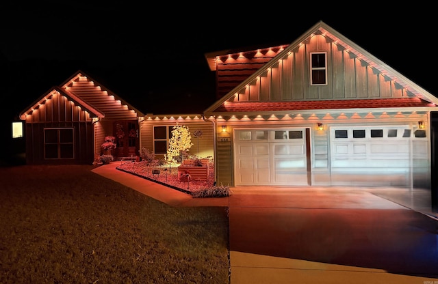 view of front of house featuring a garage, driveway, and board and batten siding