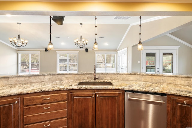 kitchen featuring dishwasher, light stone counters, a sink, and visible vents