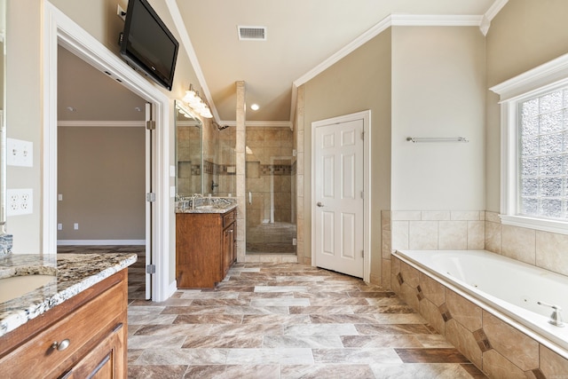 bathroom with a stall shower, visible vents, a garden tub, crown molding, and vanity