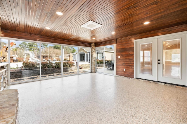 unfurnished sunroom featuring french doors and wood ceiling