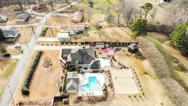 birds eye view of property with a residential view