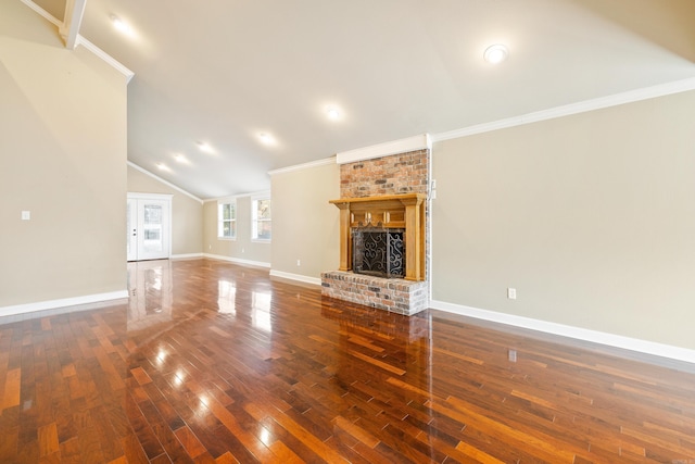 unfurnished living room with ornamental molding, a fireplace, baseboards, and hardwood / wood-style flooring