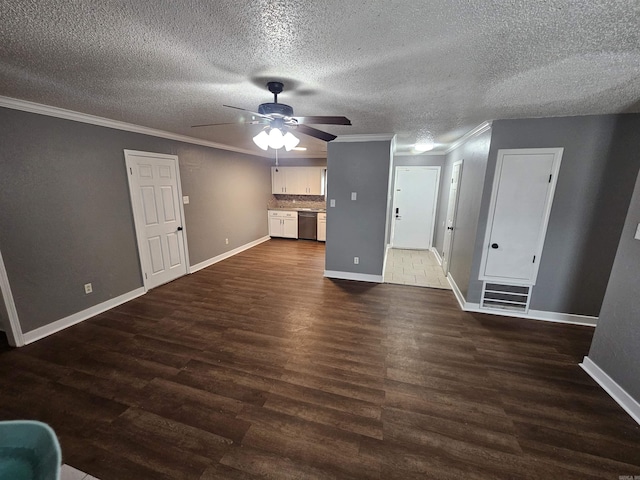 unfurnished living room with ceiling fan, visible vents, baseboards, dark wood finished floors, and crown molding