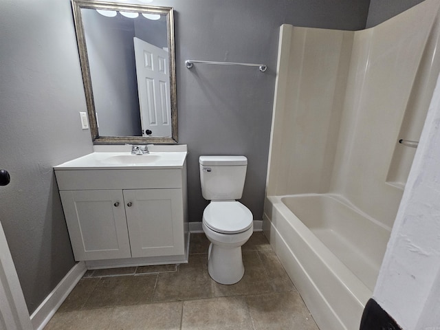 bathroom with toilet, baseboards, and vanity