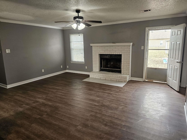 unfurnished living room with visible vents, dark wood-style flooring, and crown molding