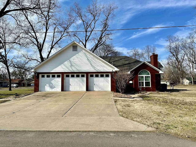 312 State St, Dardanelle, AR 72834 - view of front of home with brick siding and a chimney