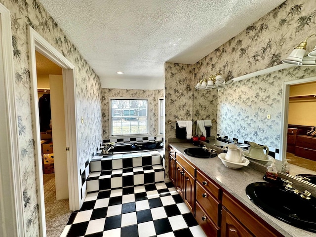 312 State St, Dardanelle, AR 72834 - kitchen featuring a sink, wallpapered walls, a textured ceiling, and light floors