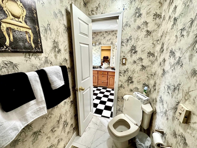 312 State St, Dardanelle, AR 72834 - bathroom with marble finish floor, toilet, a textured ceiling, vanity, and wallpapered walls