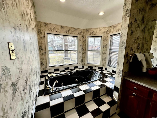 312 State St, Dardanelle, AR 72834 - full bath with lofted ceiling, a jetted tub, recessed lighting, and wallpapered walls
