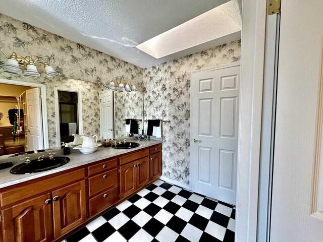 312 State St, Dardanelle, AR 72834 - bathroom with wallpapered walls, a sink, and tile patterned floors