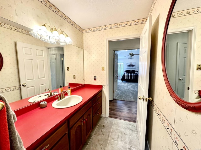 312 State St, Dardanelle, AR 72834 - bathroom featuring wallpapered walls, baseboards, and vanity