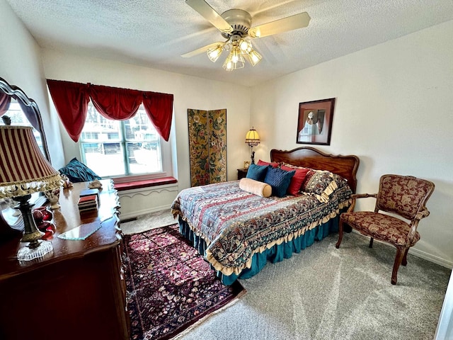 312 State St, Dardanelle, AR 72834 - bedroom featuring carpet, baseboards, ceiling fan, and a textured ceiling
