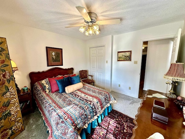 312 State St, Dardanelle, AR 72834 - bedroom with a textured ceiling, ceiling fan, carpet flooring, and baseboards