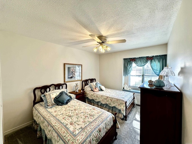 312 State St, Dardanelle, AR 72834 - bedroom featuring dark colored carpet, ceiling fan, a textured ceiling, and baseboards