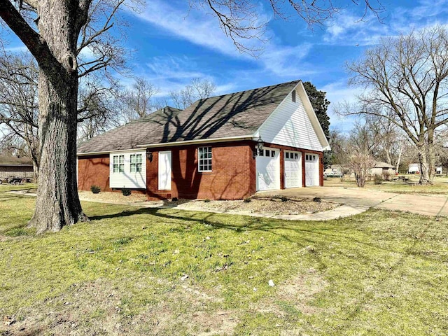 312 State St, Dardanelle, AR 72834 - exterior space with a garage, brick siding, driveway, and a front lawn