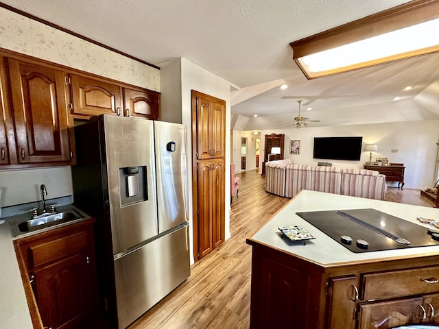 312 State St, Dardanelle, AR 72834 - kitchen with ceiling fan, a sink, light wood-style floors, open floor plan, and stainless steel fridge with ice dispenser