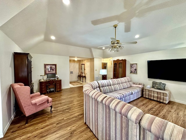 312 State St, Dardanelle, AR 72834 - living area with recessed lighting, a ceiling fan, vaulted ceiling, wood finished floors, and baseboards