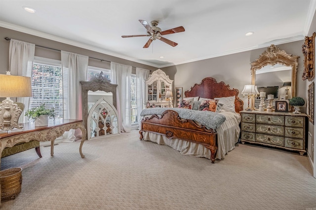 bedroom featuring carpet, a ceiling fan, and crown molding