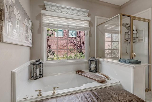 full bath with a stall shower, crown molding, and a bath