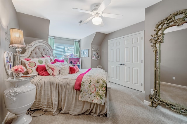 carpeted bedroom with baseboards, a closet, visible vents, and a ceiling fan