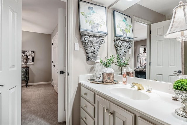 bathroom featuring baseboards and vanity