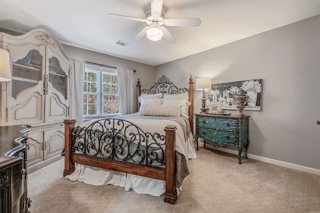 bedroom with visible vents, ceiling fan, light carpet, and baseboards